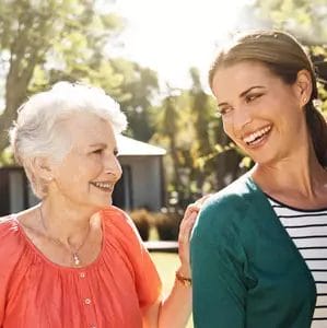 Senior client and daughter enjoying time outdoors