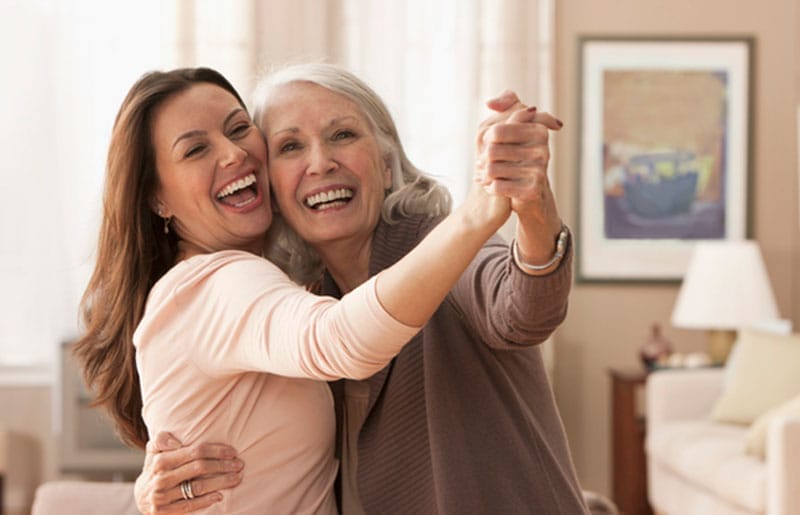 A woman who had some creative gift ideas for Mother’s Day dances with her mother, as they enjoy quality time together.